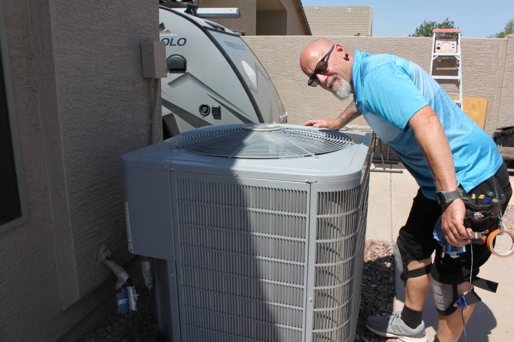 Home Inspector Daren Wright inspecting and HVAC unit
